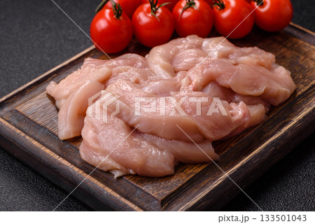 Strips of raw chicken or turkey fillet, skinless and boneless poultry breast. Chicken fillet strips Strips of raw chicken or turkey fillet, skinless and boneless poultry breast. Chicken fillet strips 133501043