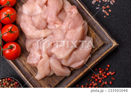 Strips of raw chicken or turkey fillet, skinless and boneless poultry breast. Chicken fillet strips Strips of raw chicken or turkey fillet, skinless and boneless poultry breast. Chicken fillet strips 133501048