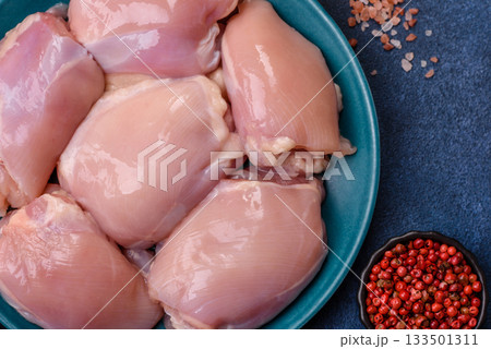 Raw chicken thigh fillet, poultry meat as a source of protein. Chicken thigh fillet Raw chicken thigh fillet, poultry meat as a source of protein. Chicken thigh fillet 133501311