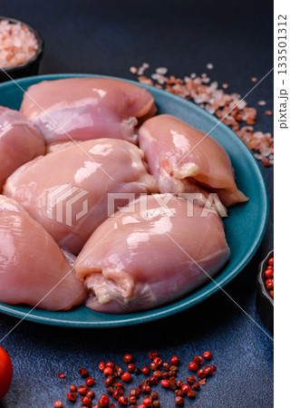 Raw chicken thigh fillet, poultry meat as a source of protein. Chicken thigh fillet Raw chicken thigh fillet, poultry meat as a source of protein. Chicken thigh fillet 133501312