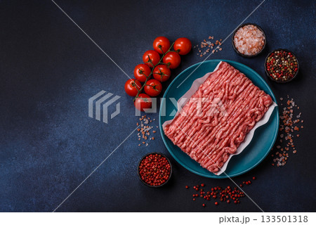 Raw ground beef or pork, prepared meat for burgers or other food preparation. Raw ground beef 133501318