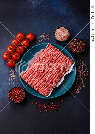 Raw ground beef or pork, prepared meat for burgers or other food preparation. Raw ground beef 133501319