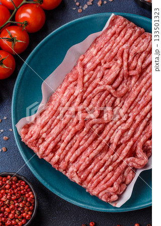 Raw ground beef or pork, prepared meat for burgers or other food preparation. Raw ground beef 133501323