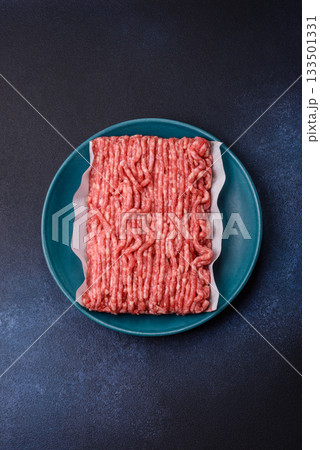 Raw ground beef or pork, prepared meat for burgers or other food preparation. Raw ground beef Raw ground beef or pork, prepared meat for burgers or other food preparation. Raw ground beef 133501331
