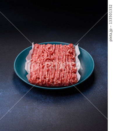 Raw ground beef or pork, prepared meat for burgers or other food preparation. Raw ground beef Raw ground beef or pork, prepared meat for burgers or other food preparation. Raw ground beef 133501332