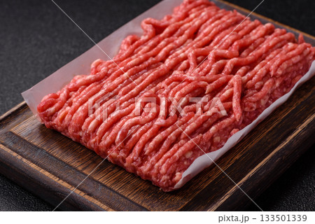 Raw ground beef or pork, prepared meat for burgers or other food preparation. Raw ground beef Raw ground beef or pork, prepared meat for burgers or other food preparation. Raw ground beef 133501339