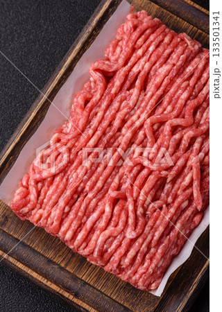 Raw ground beef or pork, prepared meat for burgers or other food preparation. Raw ground beef 133501341
