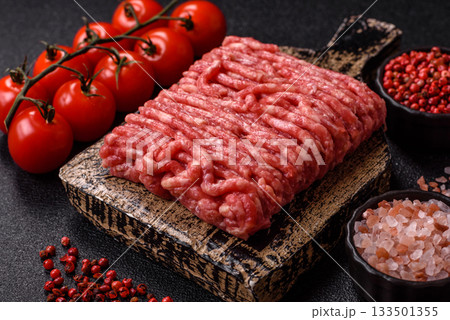 Raw ground beef or pork, prepared meat for burgers or other food preparation. Raw ground beef 133501355