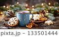 A Christmas scene with a hot drink in a blue mug, decorations and cookies 133501444