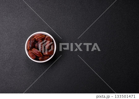 Dried dates in a ceramic plate, arabic food for the ramadan table. Dried dates as a food backgrounds 133501471