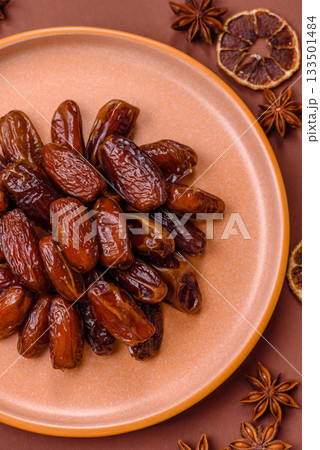 Dried dates in a ceramic plate, arabic food for the ramadan table. Dried dates as a food backgrounds 133501484