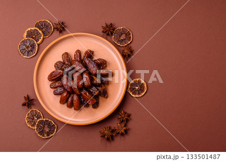 Dried dates in a ceramic plate, arabic food for the ramadan table. Dried dates as a food backgrounds 133501487
