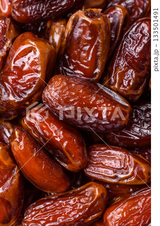 Dried dates in a ceramic plate, arabic food for the ramadan table. Dried dates as a food backgrounds 133501491