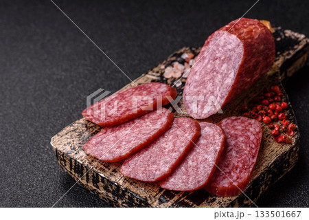Sliced salami sausage, smoked meat as a delicacy for the table. Salami sausage 133501667