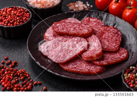 Sliced salami sausage, smoked meat as a delicacy for the table. Salami sausage 133501683