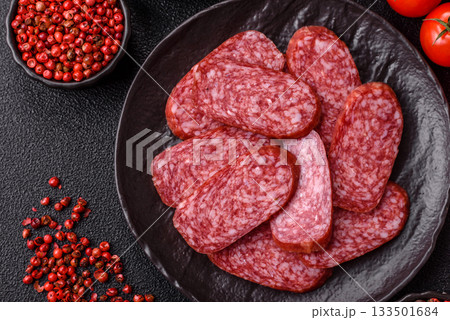 Sliced salami sausage, smoked meat as a delicacy for the table. Salami sausage 133501684