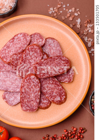 Sliced salami sausage, smoked meat as a delicacy for the table. Salami sausage 133501705
