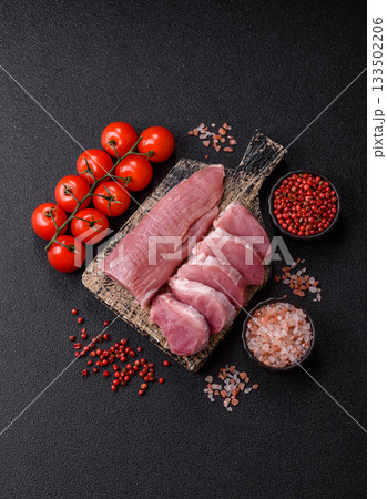 Raw pork tenderloin, sliced, is fresh meat, a source of protein. Pork tenderloin 133502206