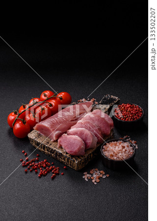 Raw pork tenderloin, sliced, is fresh meat, a source of protein. Pork tenderloin Raw pork tenderloin, sliced, is fresh meat, a source of protein. Pork tenderloin 133502207