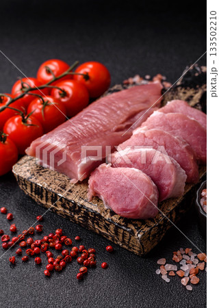 Raw pork tenderloin, sliced, is fresh meat, a source of protein. Pork tenderloin Raw pork tenderloin, sliced, is fresh meat, a source of protein. Pork tenderloin 133502210