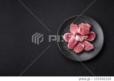 Raw pork tenderloin, sliced, is fresh meat, a source of protein. Pork tenderloin 133502220