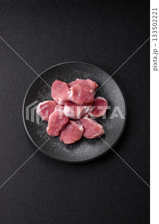 Raw pork tenderloin, sliced, is fresh meat, a source of protein. Pork tenderloin 133502221