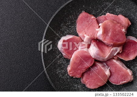 Raw pork tenderloin, sliced, is fresh meat, a source of protein. Pork tenderloin Raw pork tenderloin, sliced, is fresh meat, a source of protein. Pork tenderloin 133502224