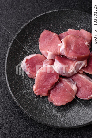 Raw pork tenderloin, sliced, is fresh meat, a source of protein. Pork tenderloin 133502225