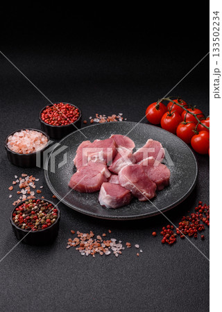 Raw pork tenderloin, sliced, is fresh meat, a source of protein. Pork tenderloin Raw pork tenderloin, sliced, is fresh meat, a source of protein. Pork tenderloin 133502234