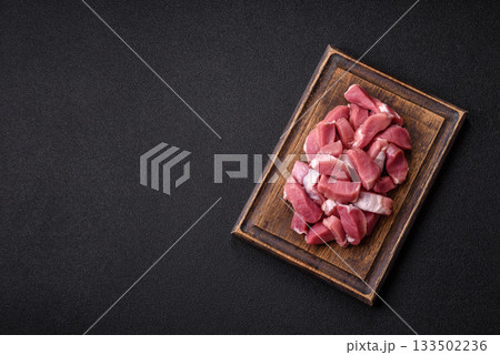 Raw pork, sliced, fresh meat, a source of protein, and an ingredient for a hearty meal. Raw pork Raw pork, sliced, fresh meat, a source of protein, and an ingredient for a hearty meal. Raw pork 133502236