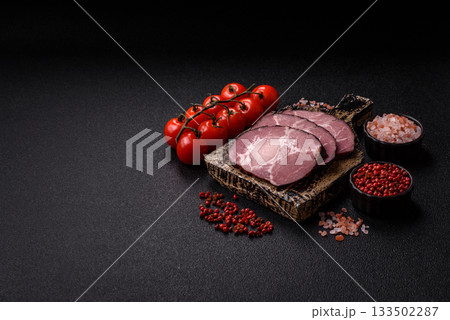 Ham, a meat cooked and sliced for sandwiches or Christmas table. Ham slices Ham, a meat cooked and sliced for sandwiches or Christmas table. Ham slices 133502287