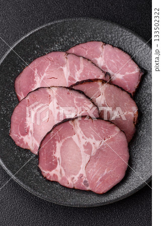 Ham, a meat cooked and sliced for sandwiches or Christmas table. Ham slices Ham, a meat cooked and sliced for sandwiches or Christmas table. Ham slices 133502322