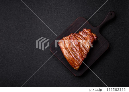 Grilled or barbecued pork or beef ribs with sauce. Cooked or smoked ribs Grilled or barbecued pork or beef ribs with sauce. Cooked or smoked ribs 133502333