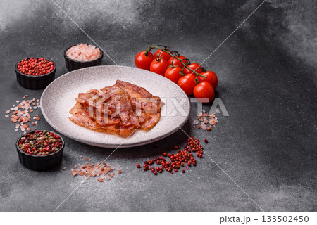 Fried pork bacon slices or strips as a breakfast ingredient. Fried bacon 133502450