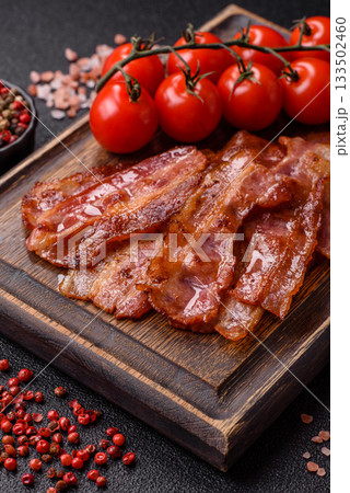 Fried pork bacon slices or strips as a breakfast ingredient. Fried bacon 133502460