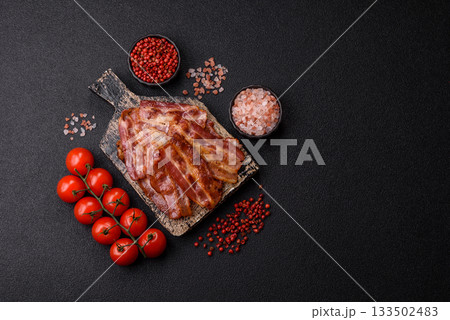 Fried pork bacon slices or strips as a breakfast ingredient. Fried bacon 133502483