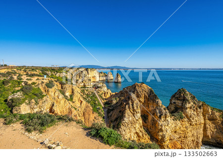 Ponta da Piedade is a unique rock formation with famous grottos in the ocean at Lagos, Algrave, Portugal 133502663