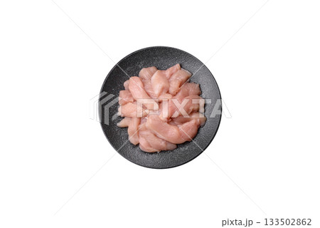 Strips of raw chicken or turkey fillet, skinless and boneless poultry breast. Chicken fillet strips 133502862