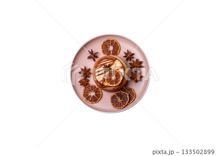 Cinnamon roll, a sweet bun with citrus, cherries, and chocolate, a Danish dessert with cream 133502899