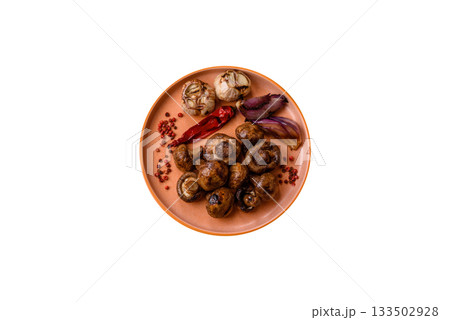 Grilled mushroom pieces, a vegetarian healthy meal with sauce. Barbecue mushroom halves 133502928