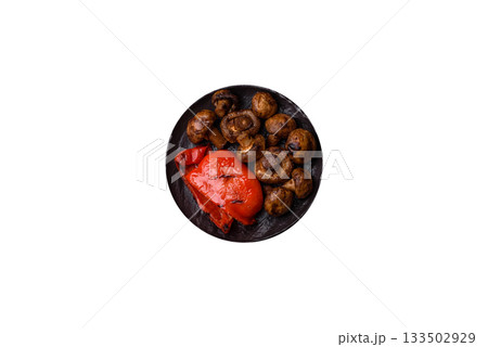 Grilled mushroom pieces, a vegetarian healthy meal with sauce. Barbecue mushroom halves Grilled mushroom pieces, a vegetarian healthy meal with sauce. Barbecue mushroom halves 133502929