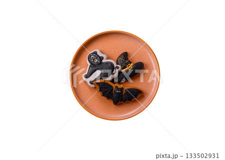 Halloween cookies, sweets, or gingerbread, a cat, a bat, and a hat. Halloween gingerbread 133502931