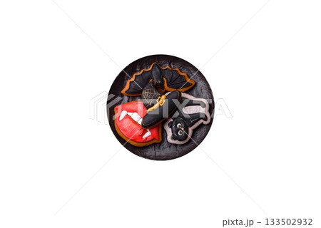 Halloween cookies, sweets, or gingerbread, a cat, a bat, and a hat. Halloween gingerbread 133502932