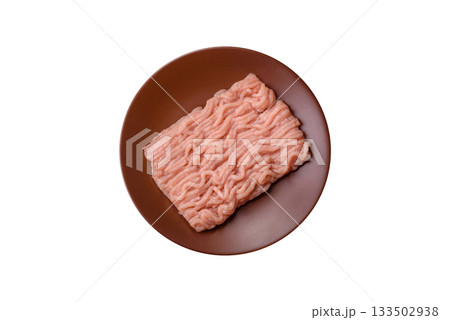 Raw minced chicken for a burger or as an ingredient in a meat dish. Raw ground chicken 133502938