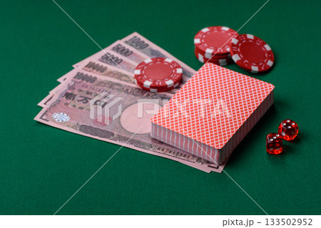 Casino game in the Japan, yen money, chips, cards. Gambling in casinos in the Japan 133502952