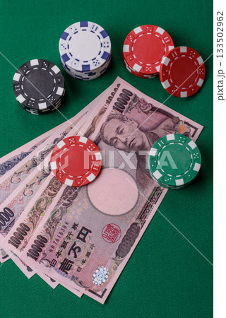 Casino game in the Japan, yen money, chips, cards. Gambling in casinos in the Japan Casino game in the Japan, yen money, chips, cards. Gambling in casinos in the Japan 133502962