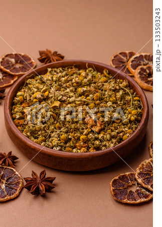 Dried chamomile flowers, herbal tea in a bowl for a hot morning drink. Dried chamomile Dried chamomile flowers, herbal tea in a bowl for a hot morning drink. Dried chamomile 133503243