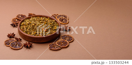 Dried chamomile flowers, herbal tea in a bowl for a hot morning drink. Dried chamomile Dried chamomile flowers, herbal tea in a bowl for a hot morning drink. Dried chamomile 133503244