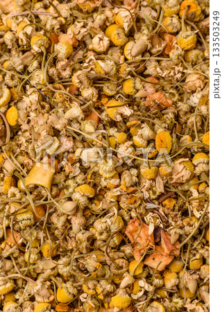 Dried chamomile flowers, herbal tea in a bowl for a hot morning drink. Dried chamomile 133503249