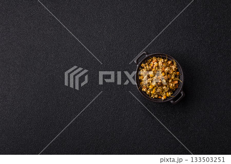 Dried chamomile flowers, herbal tea in a bowl for a hot morning drink. Dried chamomile 133503251